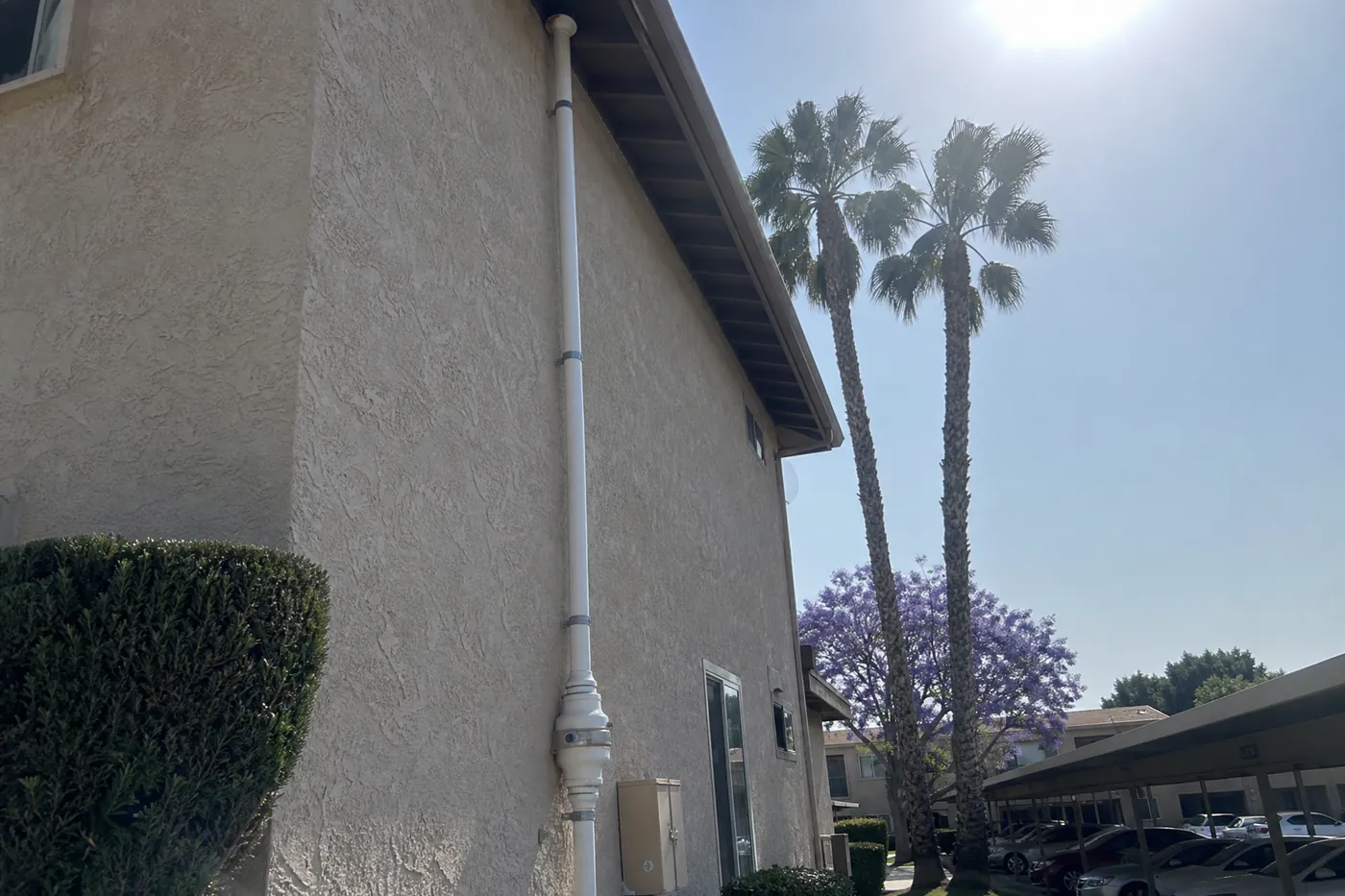 Commercial radon mitigation system riser installed on a Los Angeles apartment building