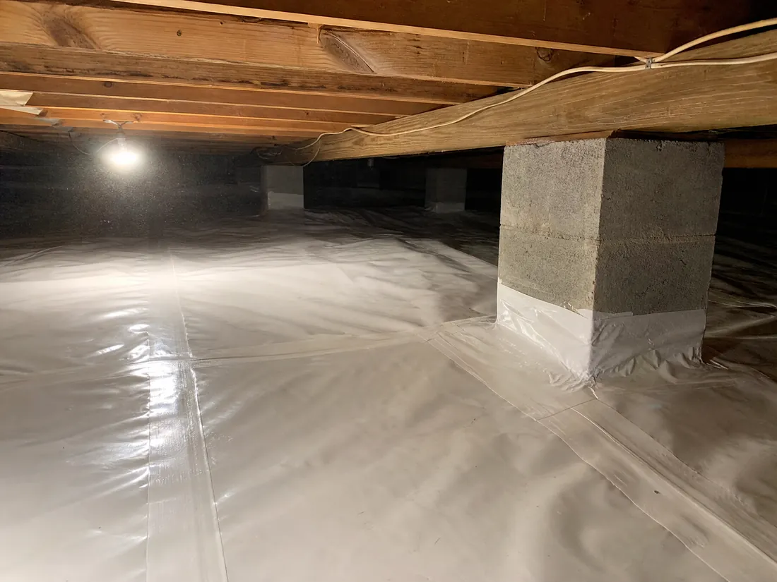Sealed vapor membrane installed in a Los Angeles commercial building crawl space for radon mitigation