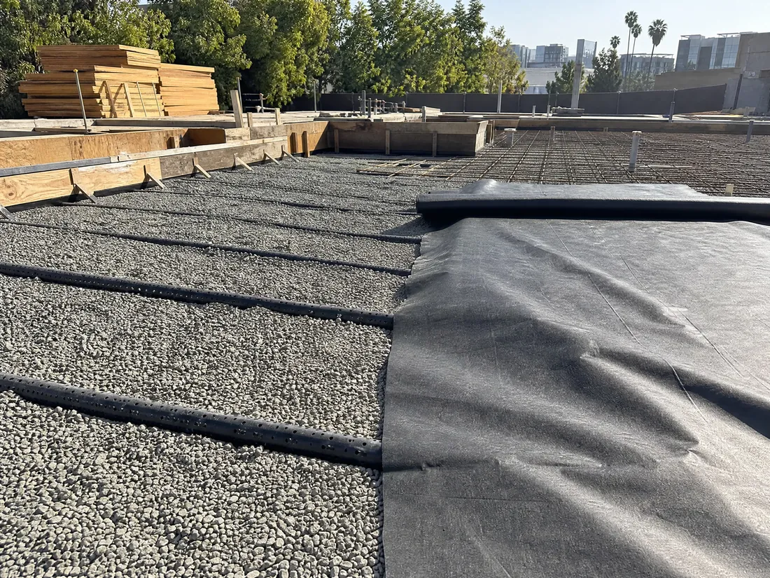 Methane barrier membrane and vent piping installed beneath a Los Angeles building slab
