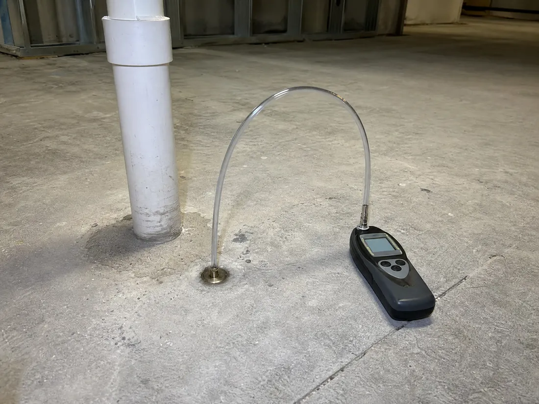 Sub-slab vapor intrusion mitigation system with sampling port installed at a Los Angeles commercial site